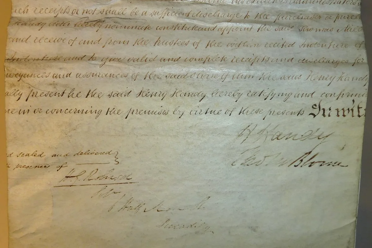 Old handwritten document, like an insurance policy to read closely