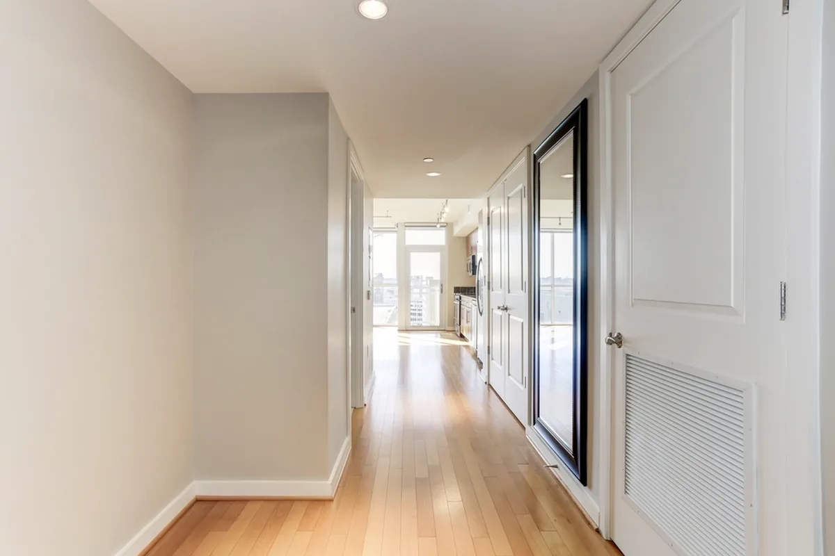 Bright quiet hallway with wood floors
