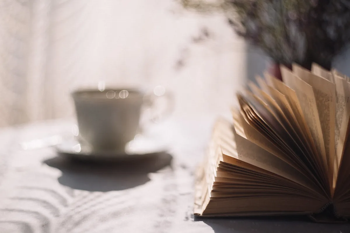 Cup of tea beside an open book, a calm setting for a hard conversation