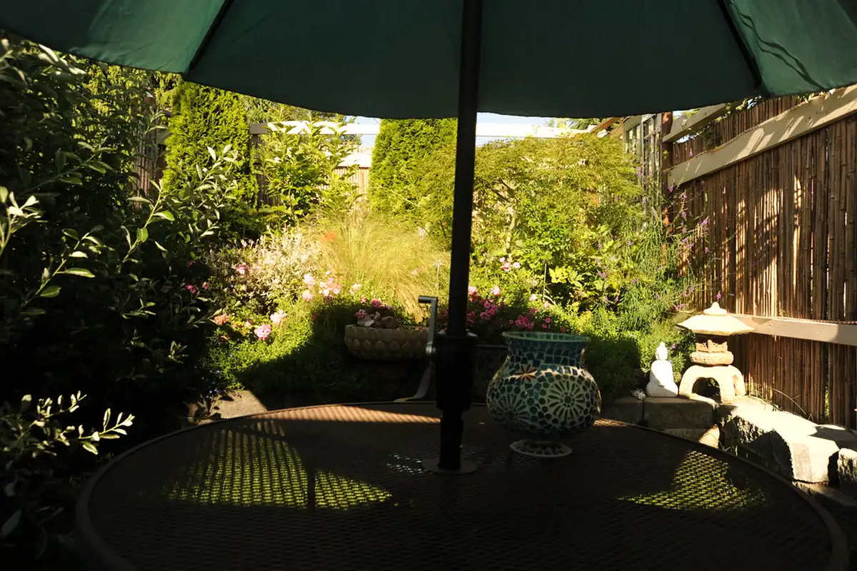 Shaded garden patio with a table, the kind of outdoor space to look for on a visit